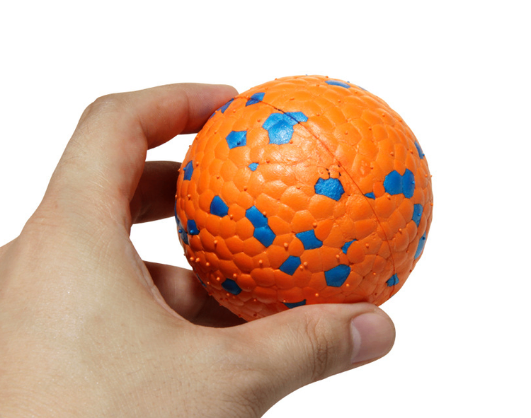 Muffy chew-resistant burst ball dog toy in burnt orange, 7cm, designed for durable chewing and interactive play