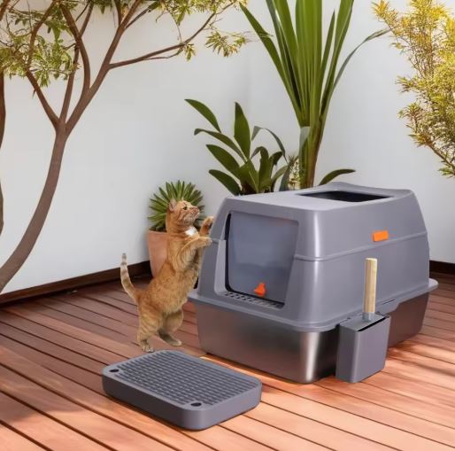 Large stainless steel fully enclosed cat litter box by Muffy with a foot pedal and gray finish, designed for easy and hygienic cat litter management.
