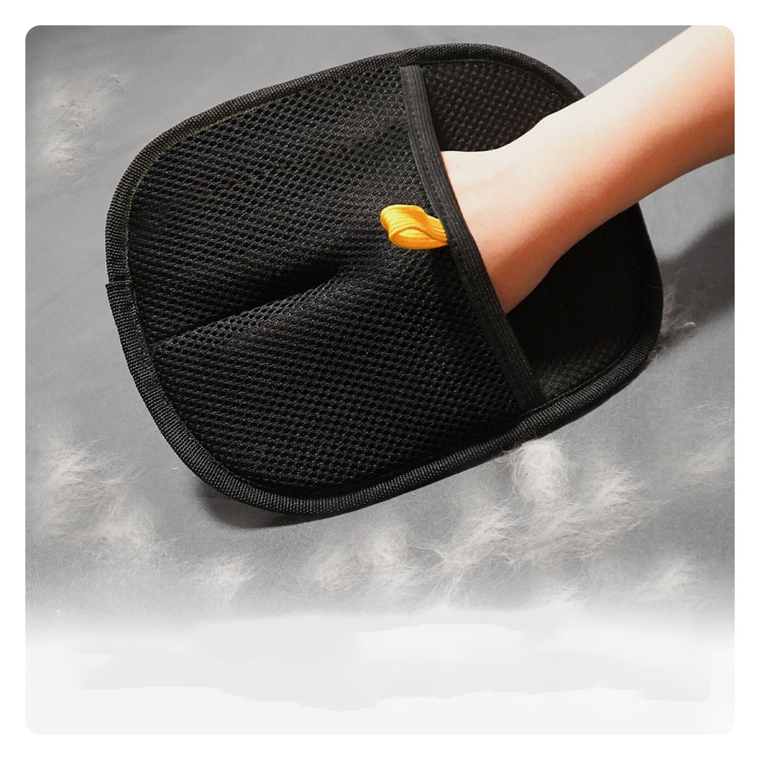 Muffy pet hair removal gloves with textured surface for grooming and removing loose pet fur from cats and dogs.