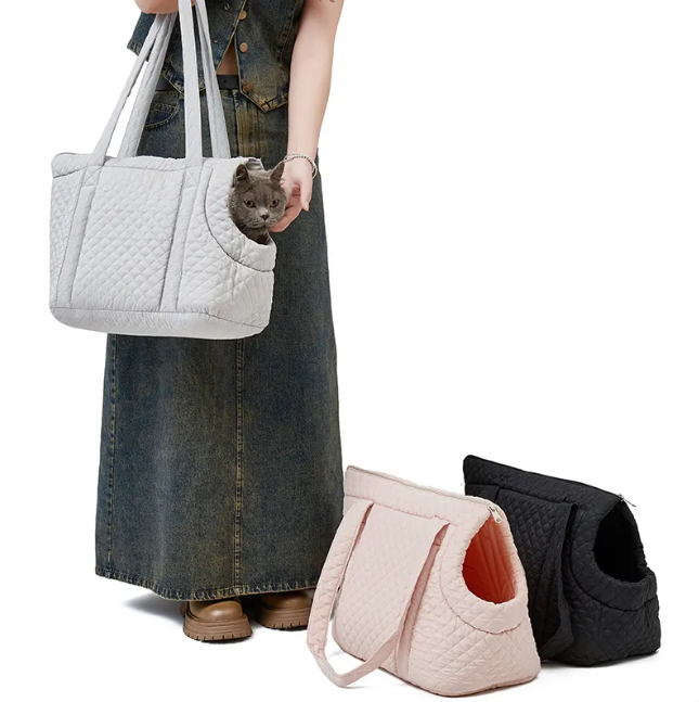 Black quilted Korean-style pet travel bag by Muffy with mesh ventilation and padded handles for comfortable transport.