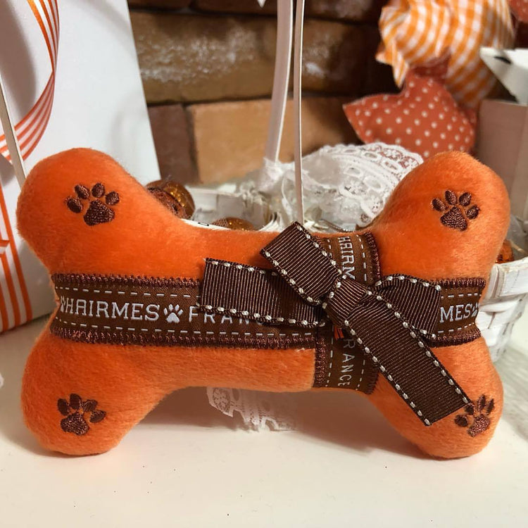Muffy luxury pet dog sound toy shaped like a bone, featuring cute design and durable material for playful pets.