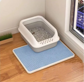 Brown double-layer cat litter mat by Muffy with a textured surface designed to trap litter and keep floors clean.