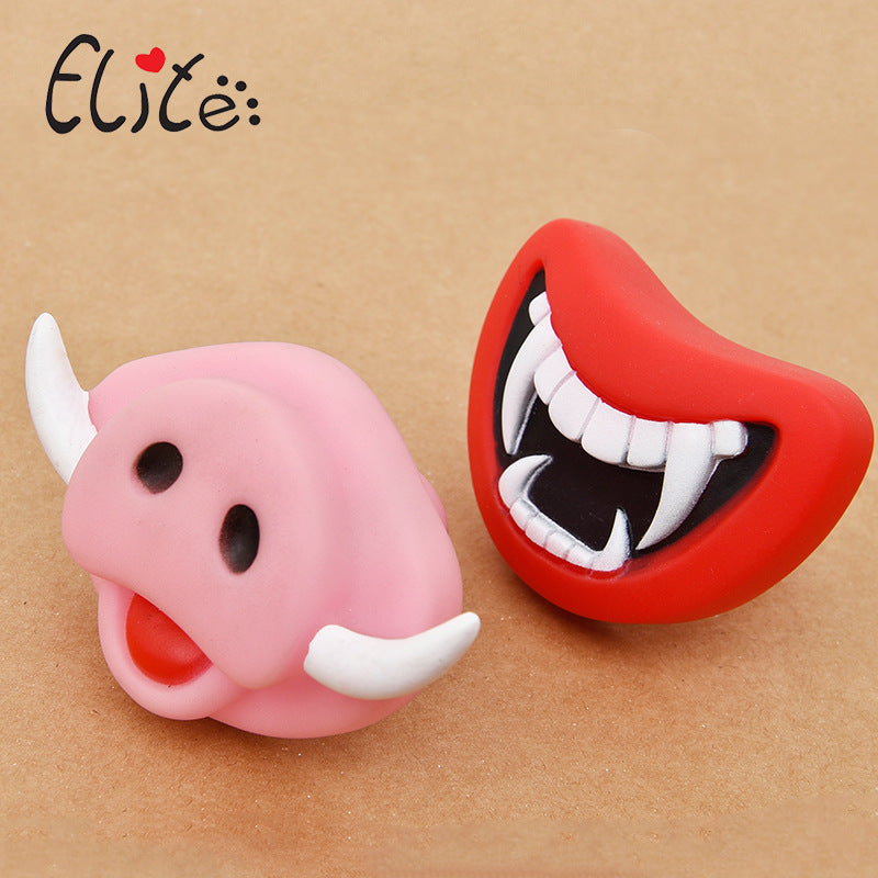 Muffy rubber squeaky dog toy shaped like a demon for dogs, designed for play and entertainment.