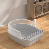Large grey semi-enclosed cat litter box by Muffy, designed for pets, with high sides and a covered entry for privacy and odor control.
