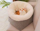 Gray round felt cat litter mat by Muffy designed for all seasons, provides durable and stylish protection for cat litter areas.