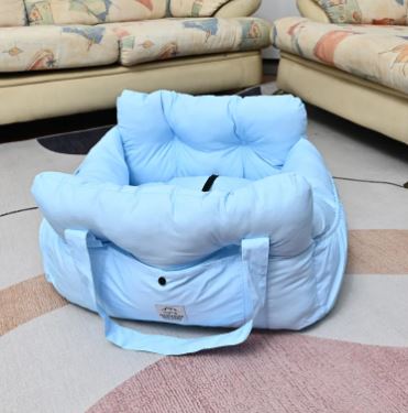 Muffy military green dog car seat bed with soft cushioning and secure sides for comfort during car travel.