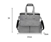 Grey Muffy pet travel bag with breathable mesh sides and sturdy handle for easy carrying and secure transport of small pets.