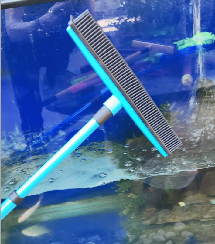 Muffy pet hair removal broom with long handle and rubber brush, designed for cleaning pet hair from floors and furniture