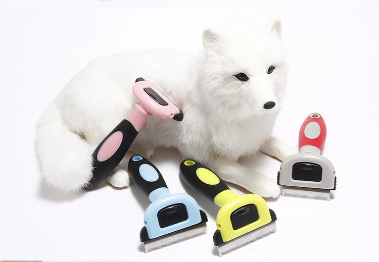 Pink Muffy ABS pet hair removal comb with removable blades for effective pet hair grooming and shedding control.