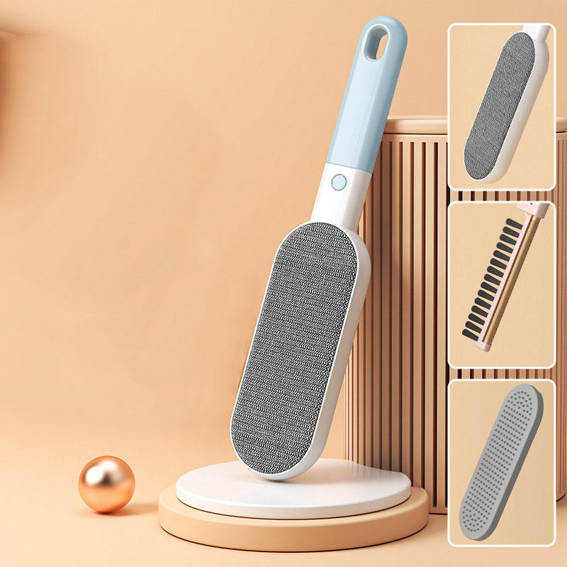 Pink double-sided pet hair removal brush by Muffy for furniture, featuring textured surfaces for effective pet hair removal.