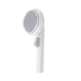 Purple Pumpkin Pet Grooming Brush by Muffy, with soft bristles, designed for gentle pet coat grooming.