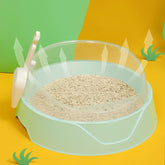Large semi-enclosed pink cat litter box with matching shovel, designed by Muffy for easy cleaning and privacy.