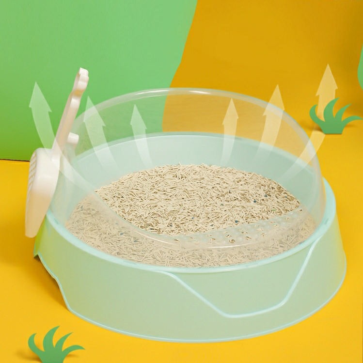 Large semi-enclosed pink cat litter box with matching shovel, designed by Muffy for easy cleaning and privacy.
