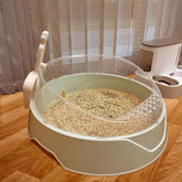 Large semi-enclosed Muffy cat litter box with a matching scoop, made of durable plastic in pink, designed for easy cleaning and privacy.