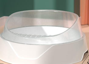 Large pink semi-enclosed cat litter box with matching scoop, designed for easy cleaning and privacy by Muffy.