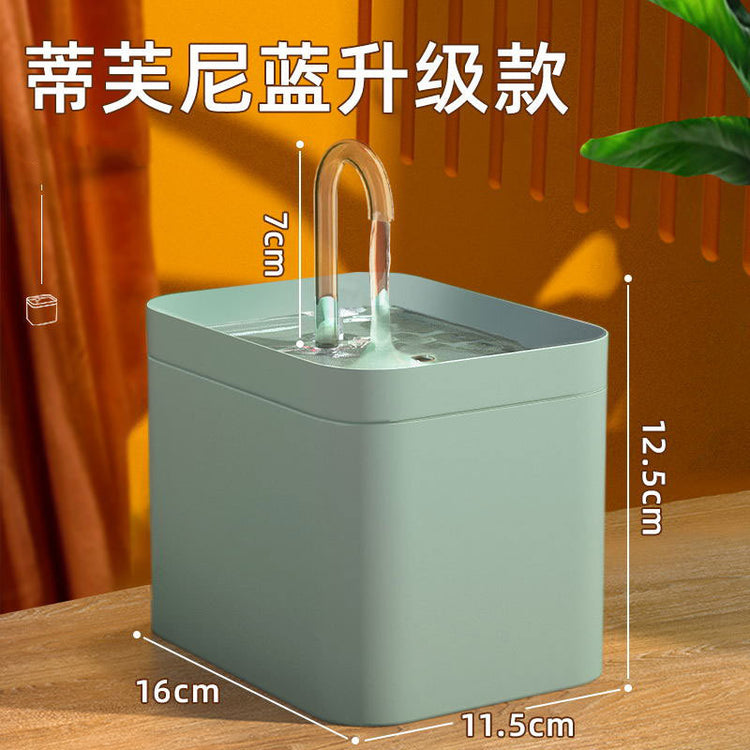 Muffy automatic cat water fountain with USB interface, green cover, white crystal elbow, designed for pet hydration.