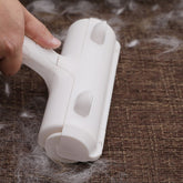 Muffy pet hair removal brush in white for carpets and furniture, effective for cleaning pet fur from soft surfaces.
